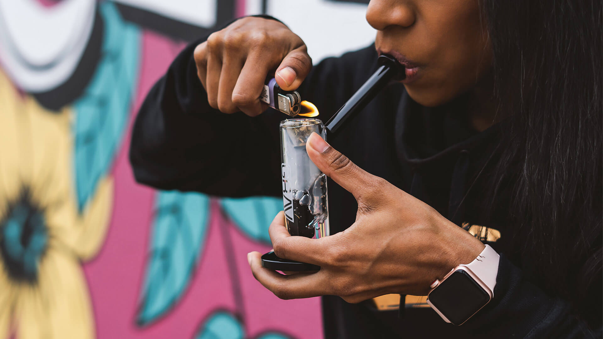 Photo of woman smoking glass bubbler